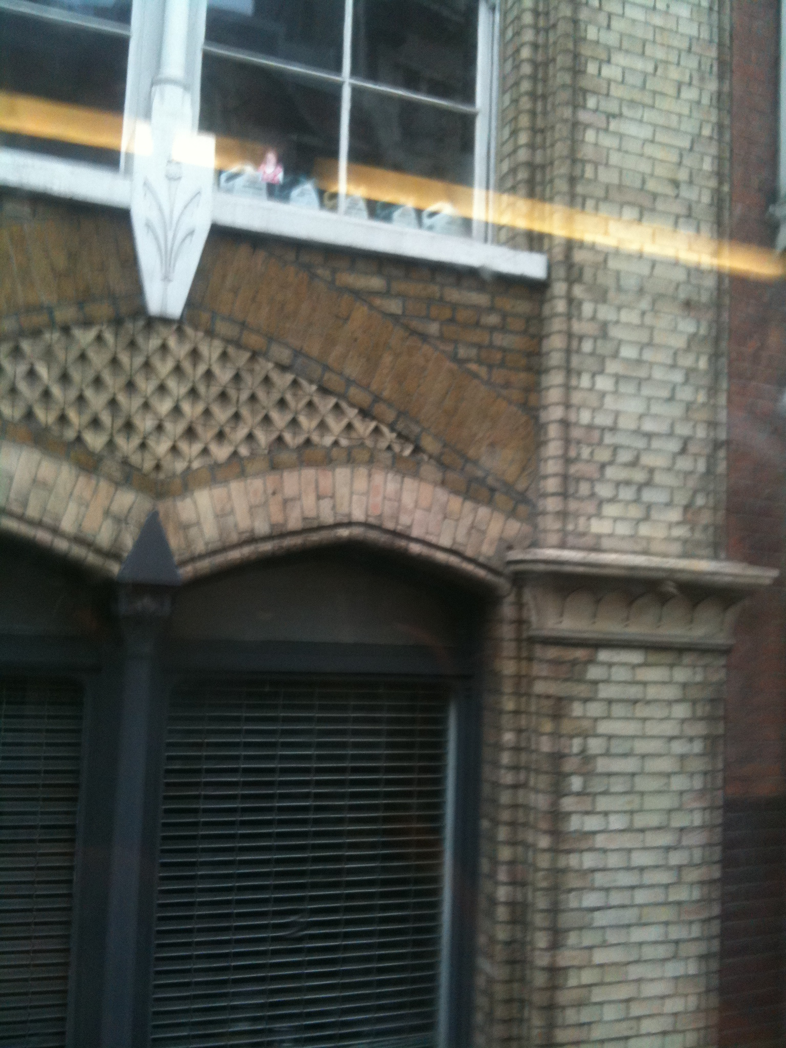 the windows and door of an old brick building