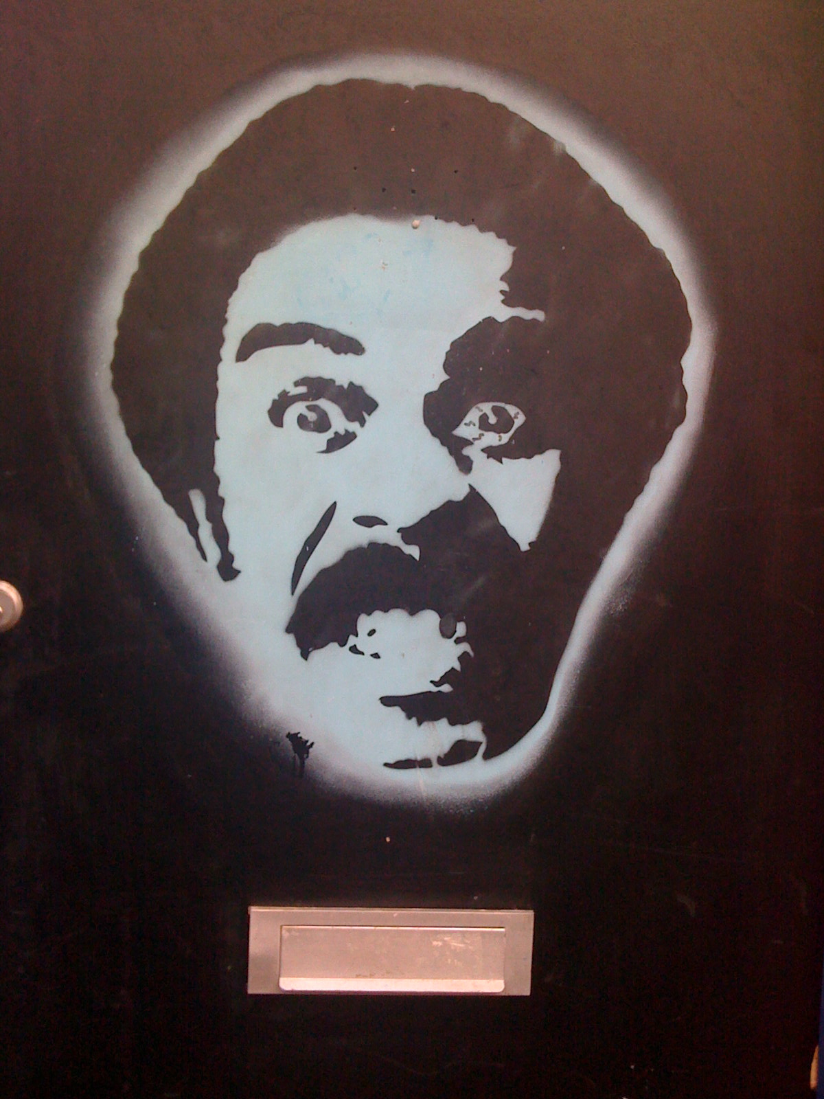 a mural with a face of stalin in white