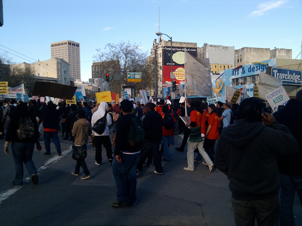 a protest rally has many signs on it