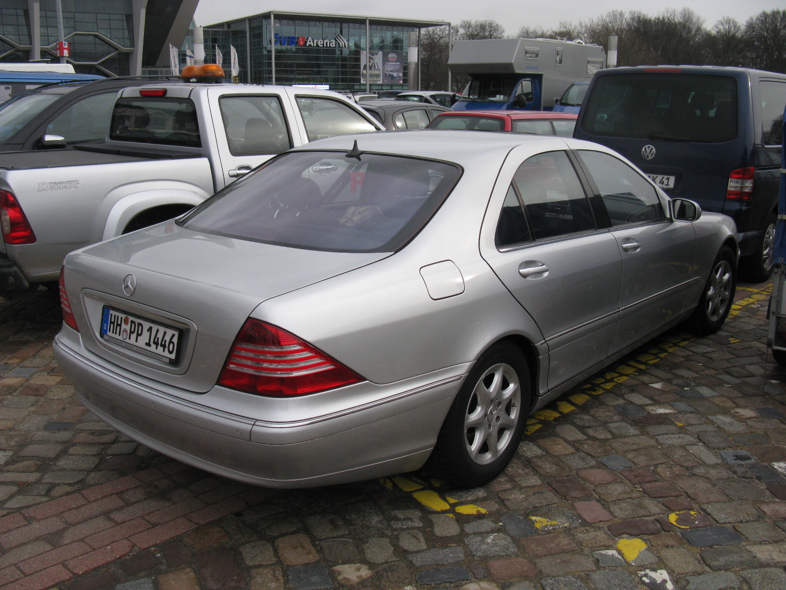 an mercedes benz coupe is parked in the parking lot