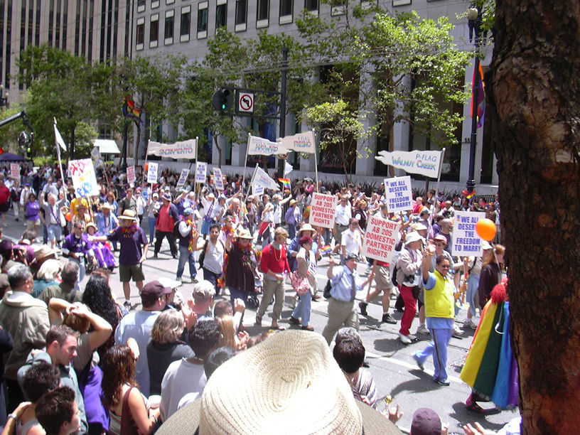 a crowd of people in the city protesting outside