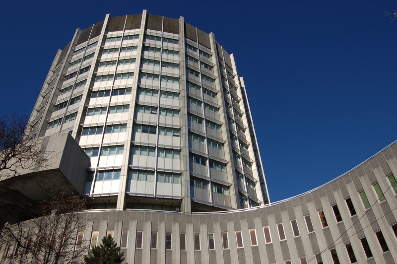 there is a large circular building in front of the building