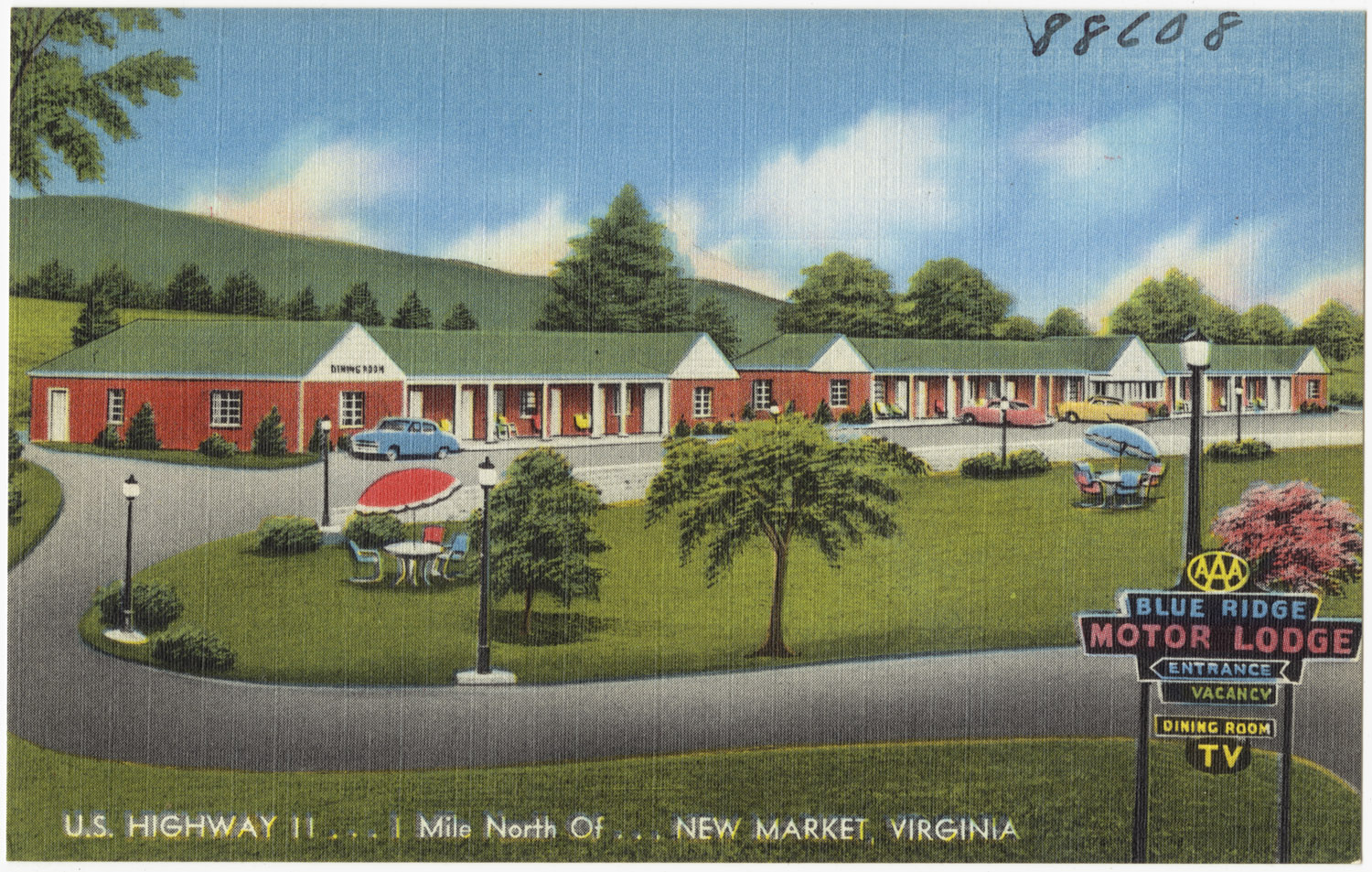 an early century colored postcard shows a motel in a rural location
