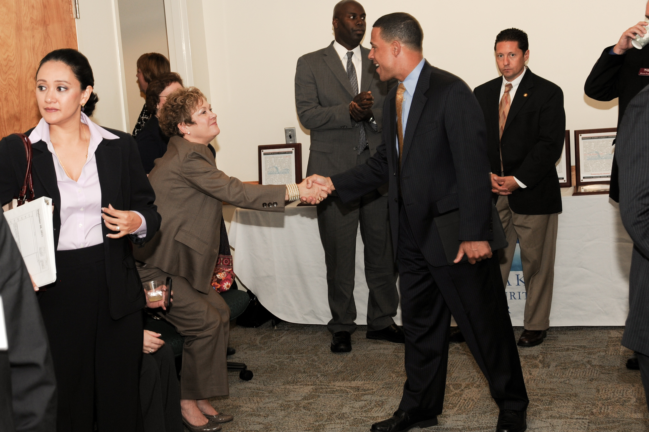 business people are in a meeting talking and shaking hands