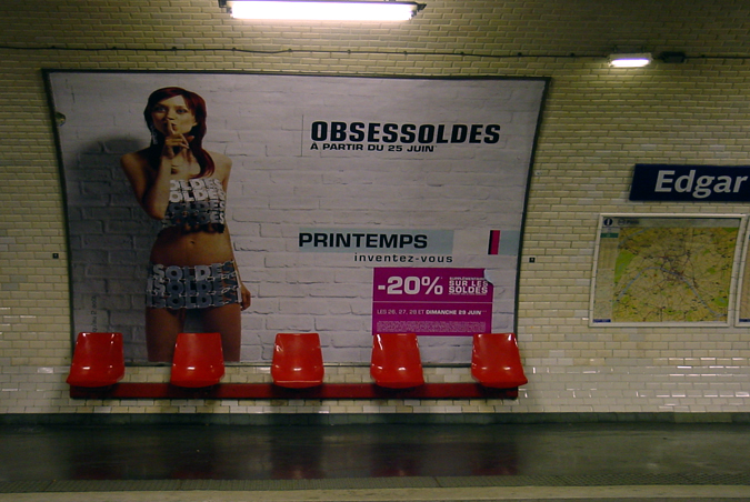 a large ad for the underwear nd is displayed in a subway station