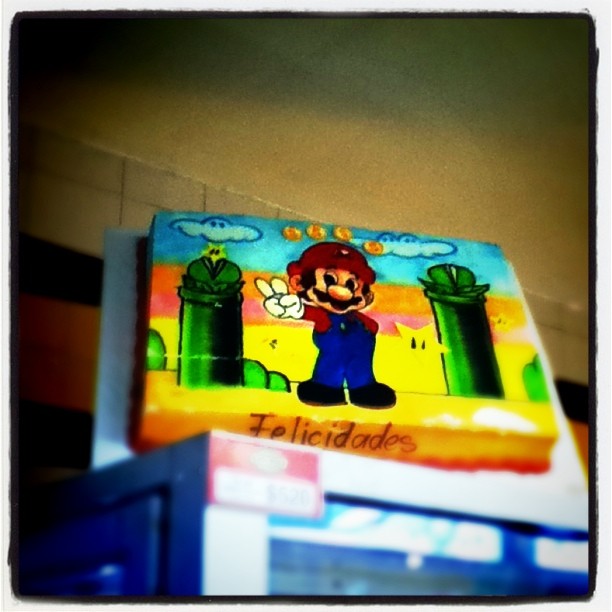 mario's adventure is painted on top of a cardboard box