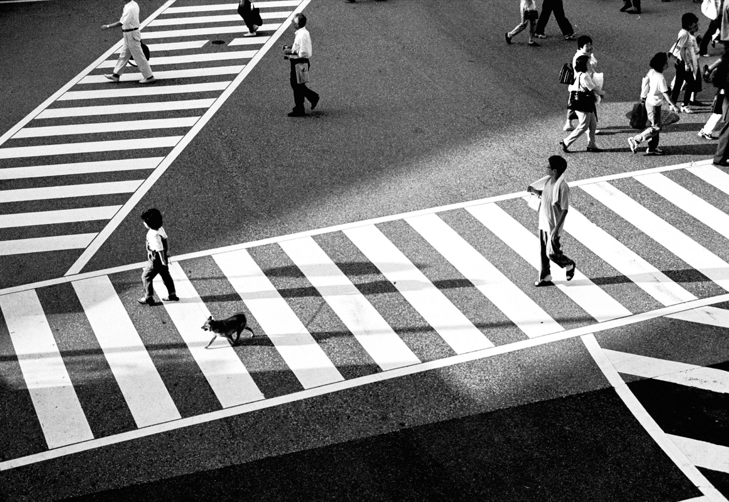 a crosswalk with pedestrians crossing it