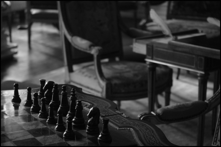 a chess set is seen in a black and white image
