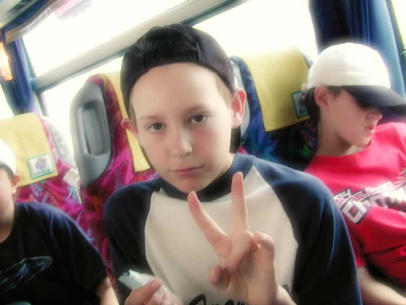 an image of a boy sitting on the bus