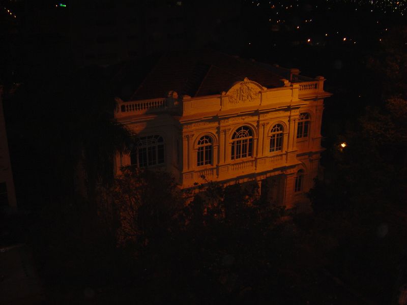 an old building lit by the night time lights