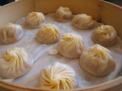 some very tasty looking dumplings in some food
