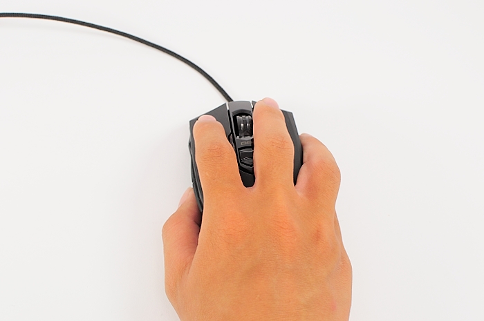 a hand using a computer mouse on a white background