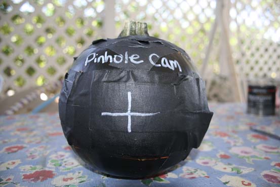 a candle that has been placed inside a pumpkin