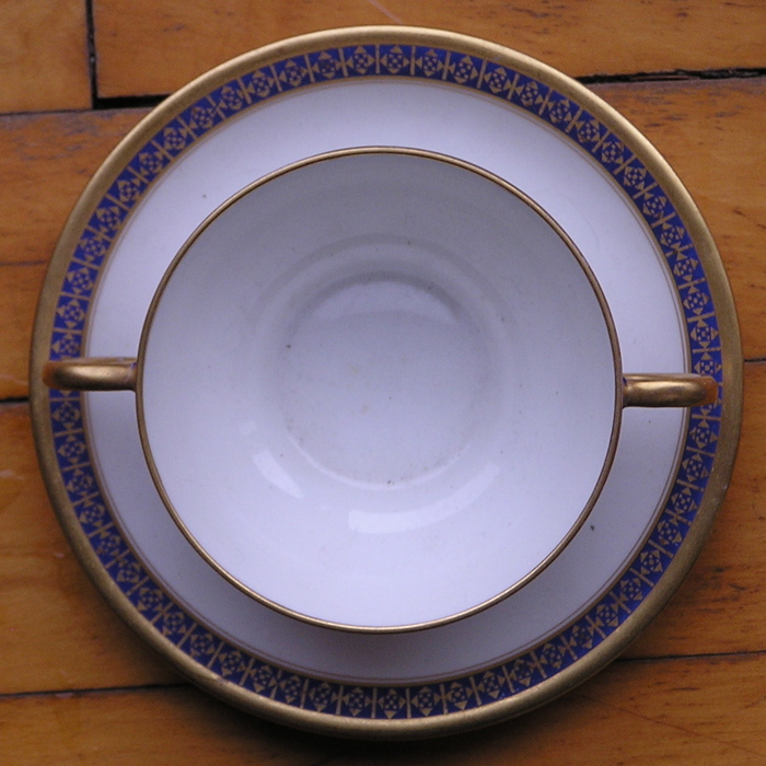 a close up of a plate on a wooden table