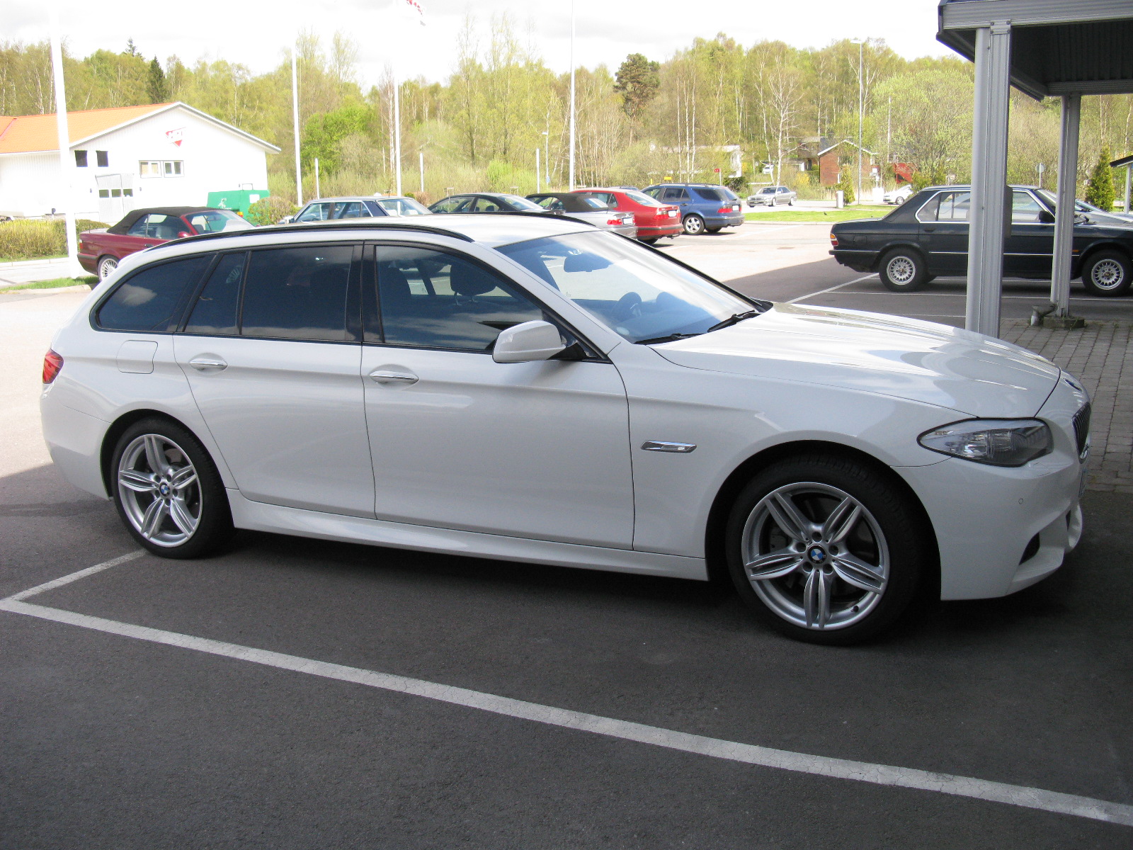 a white car parked in a parking space