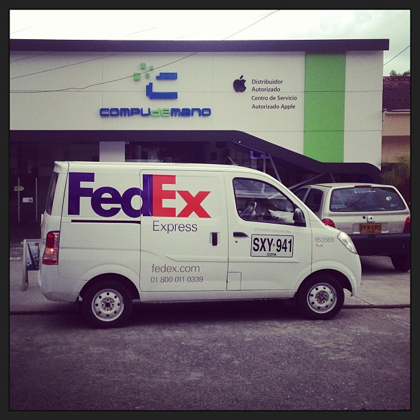 a fed ex truck outside of a building