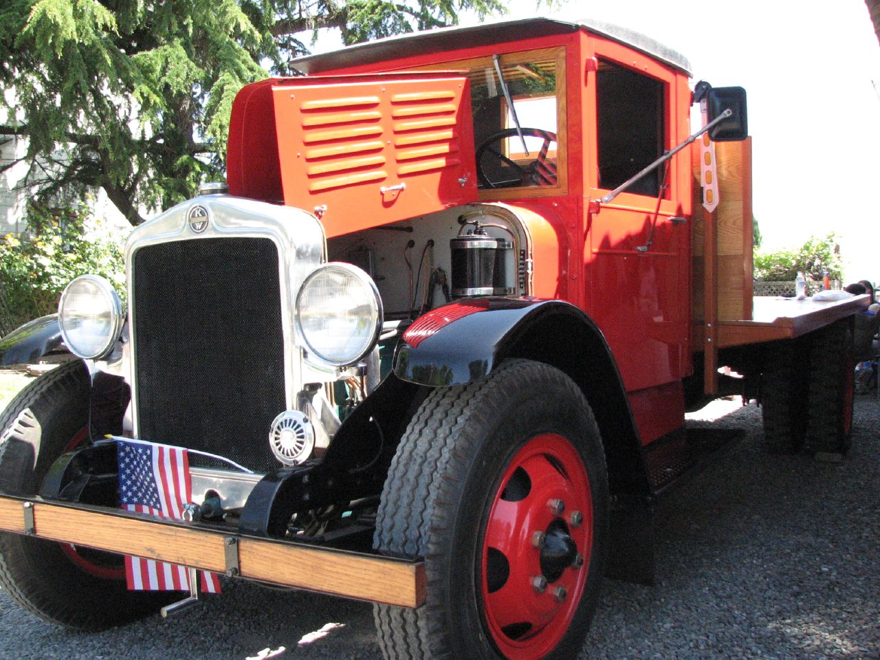 the bright orange cab of a classic truck