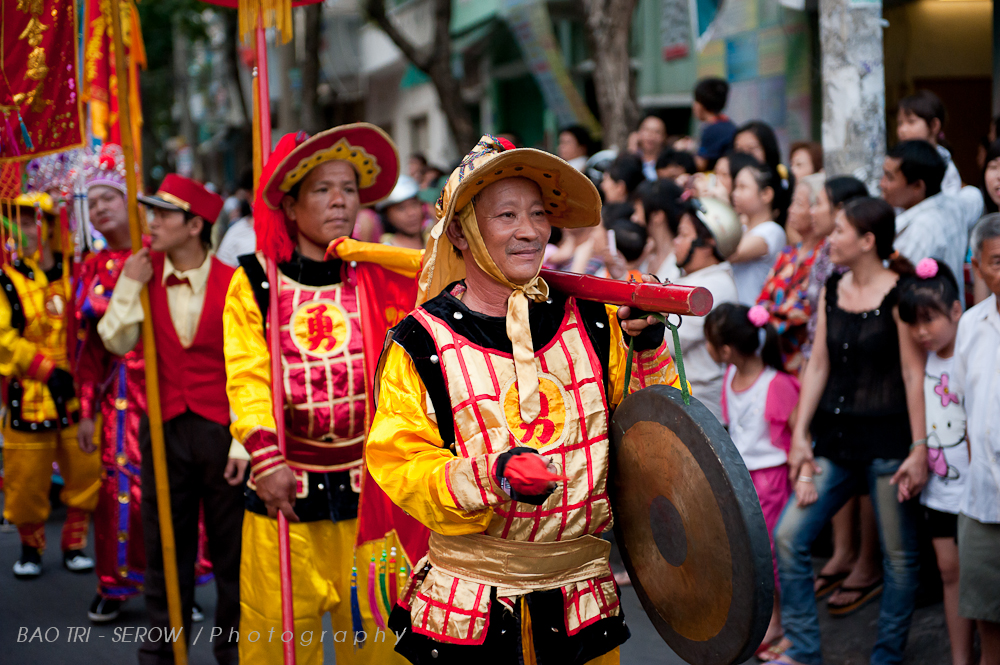 several people wearing costumes and holding drums during an event
