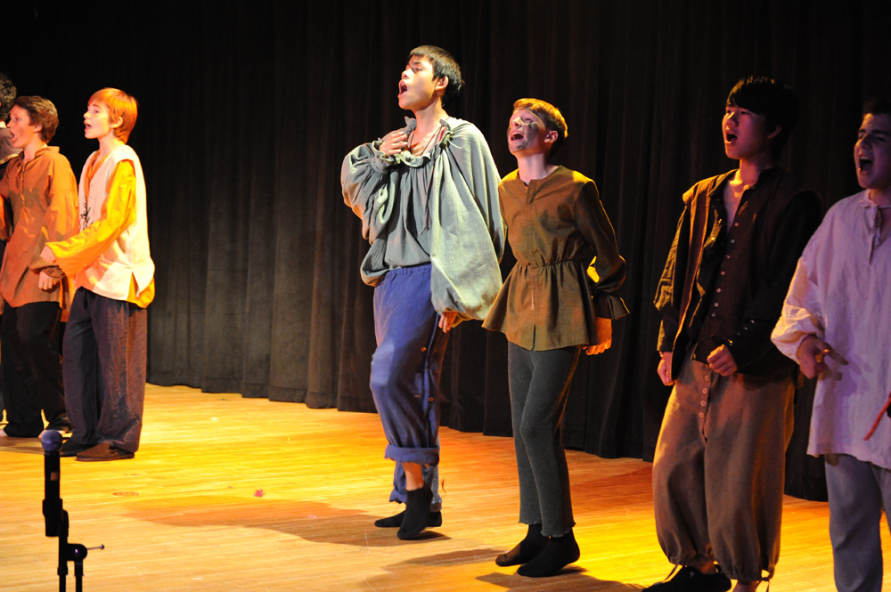 several people standing in front of a stage