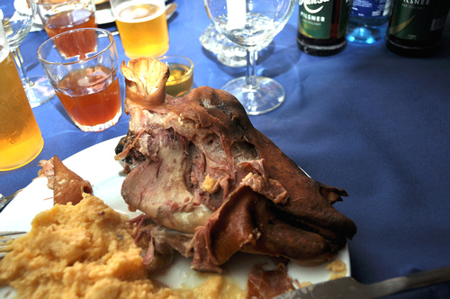 a large plate has meat and beer on it