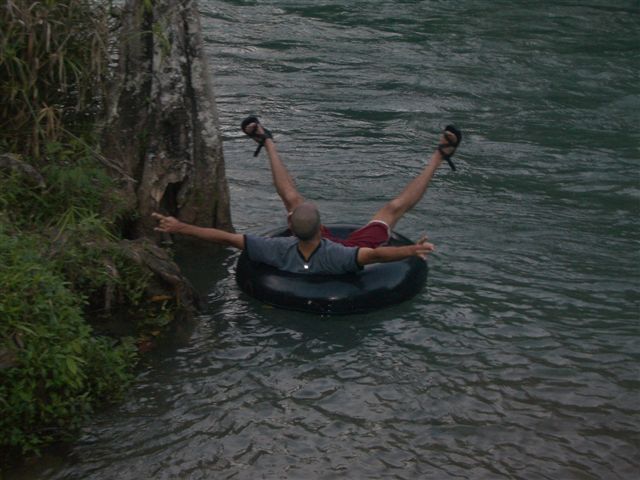a man floating on a rubber raft in the water