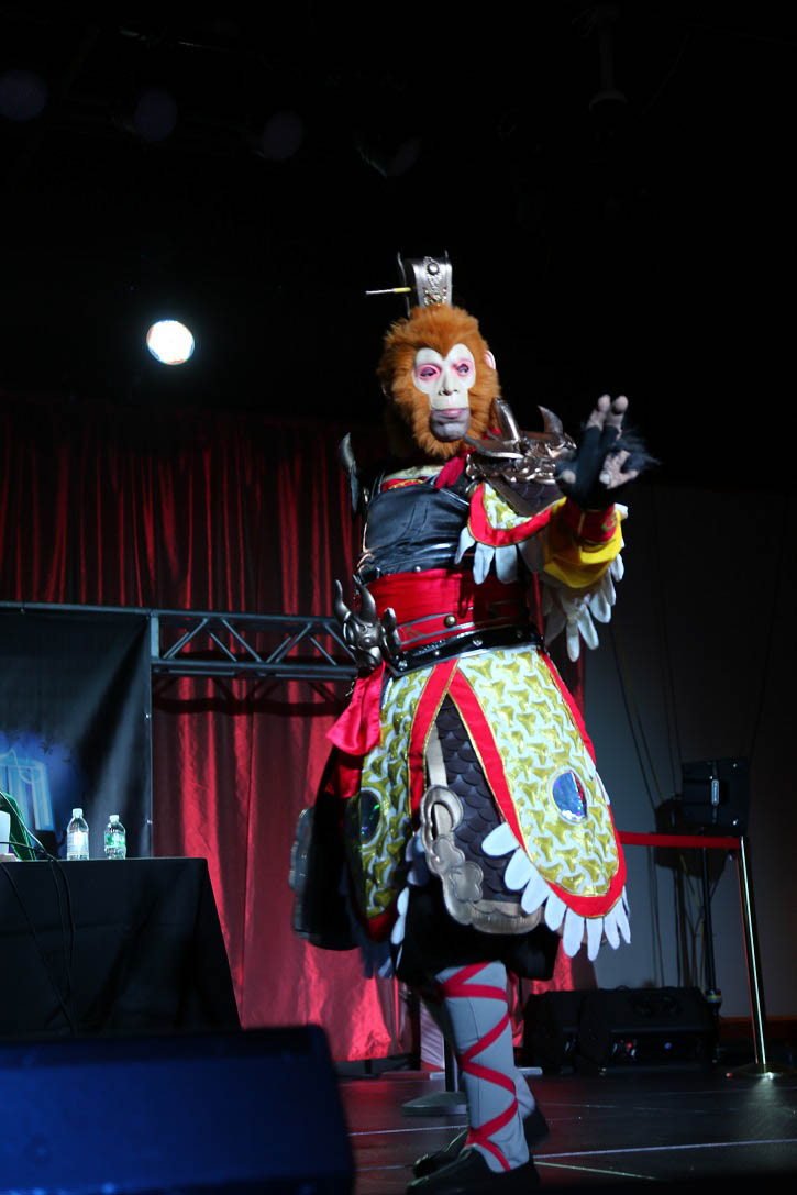 an evil clown with very short legs on a stage