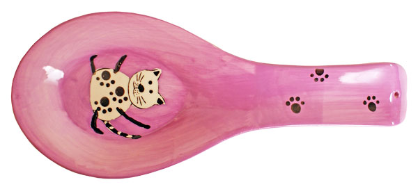 pink painted object features a dog with a yellow and black spot on it