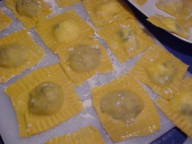 some very pretty looking ravioli that are on some pans