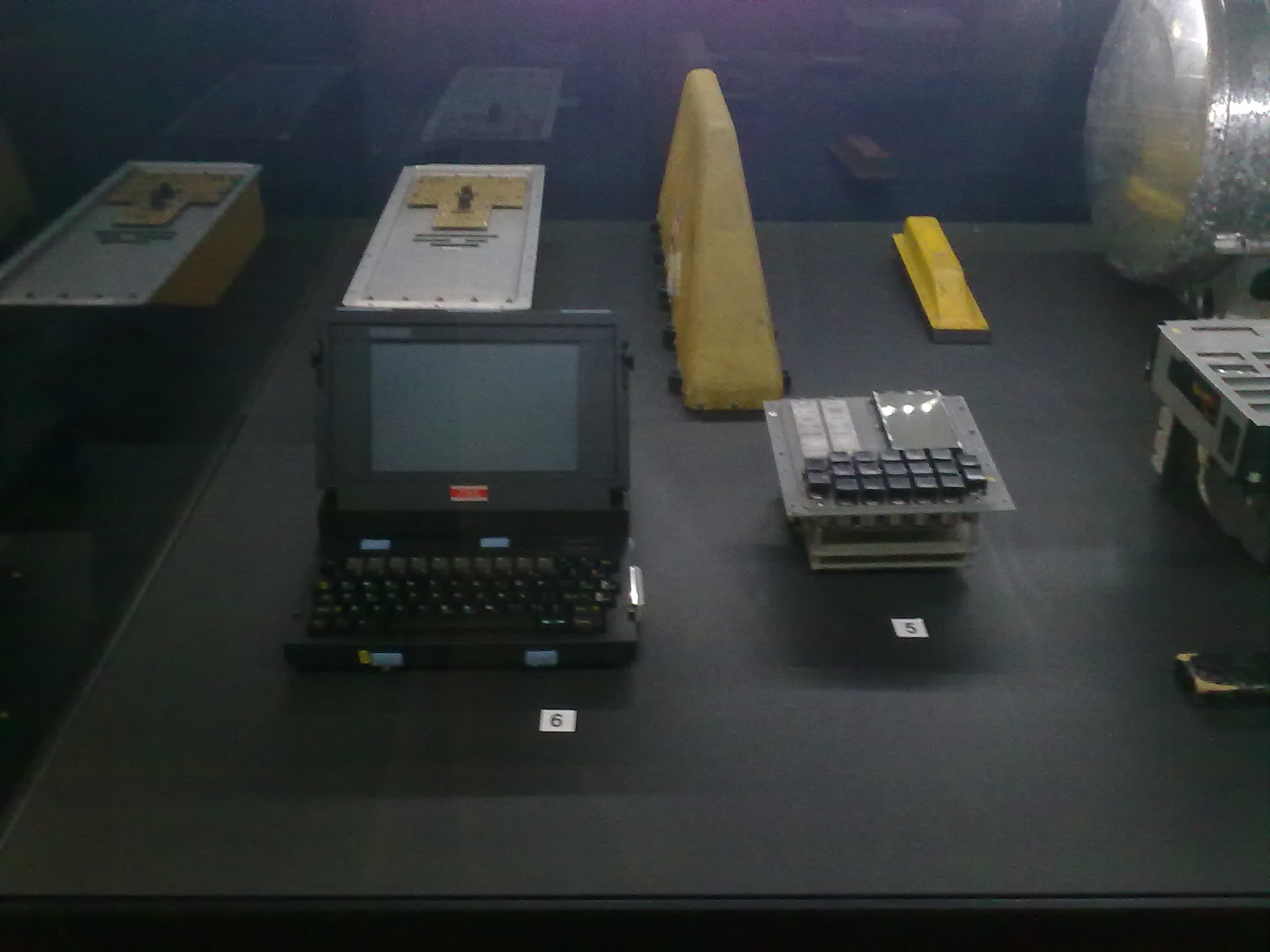a display with several different typewriters on top of a counter