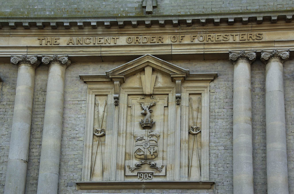 an old, large building has ornate carvings on the exterior