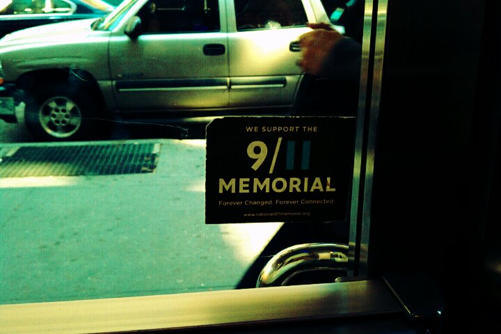 a memorial sign on the door is visible outside