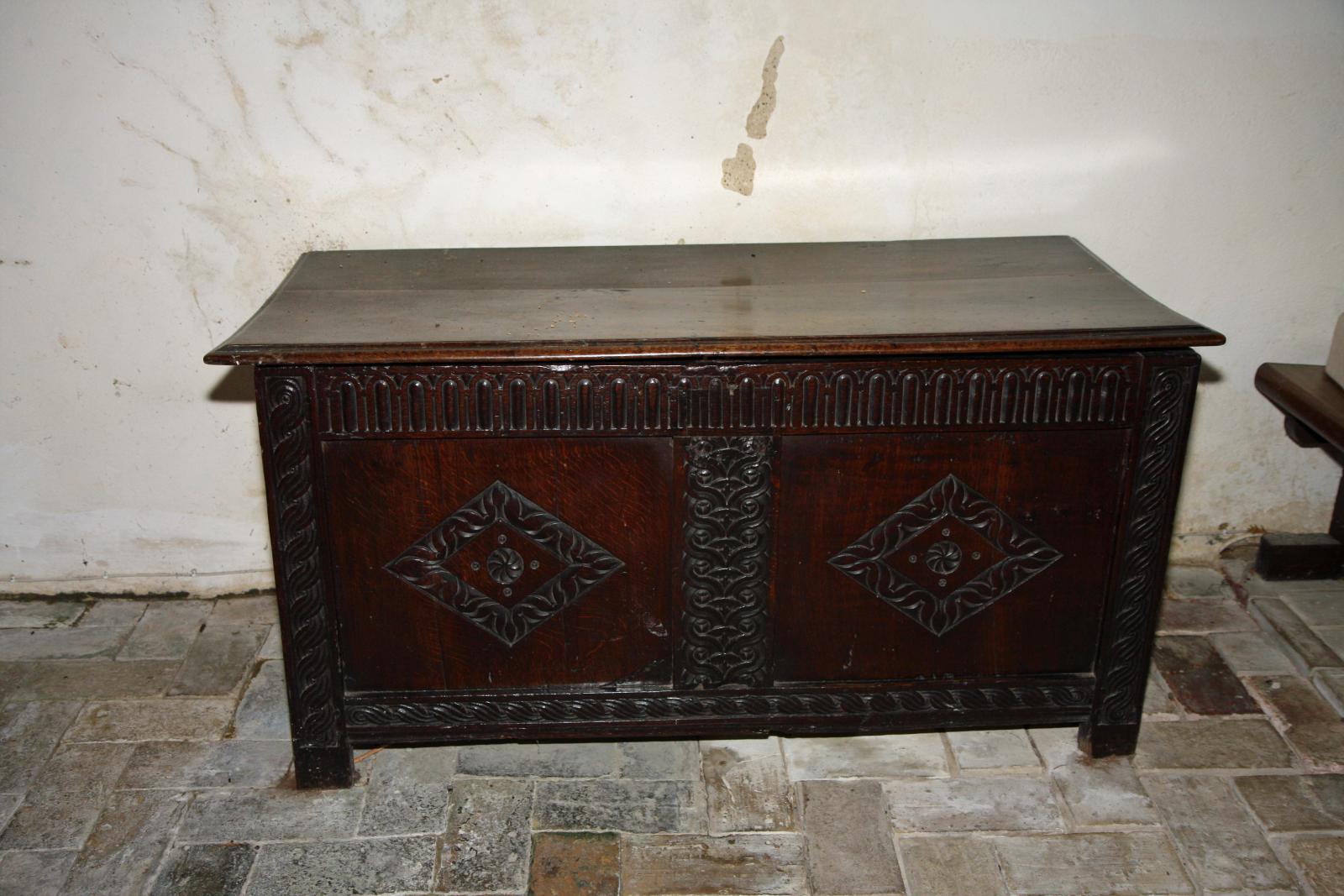 an old wooden desk with ornate designs on top