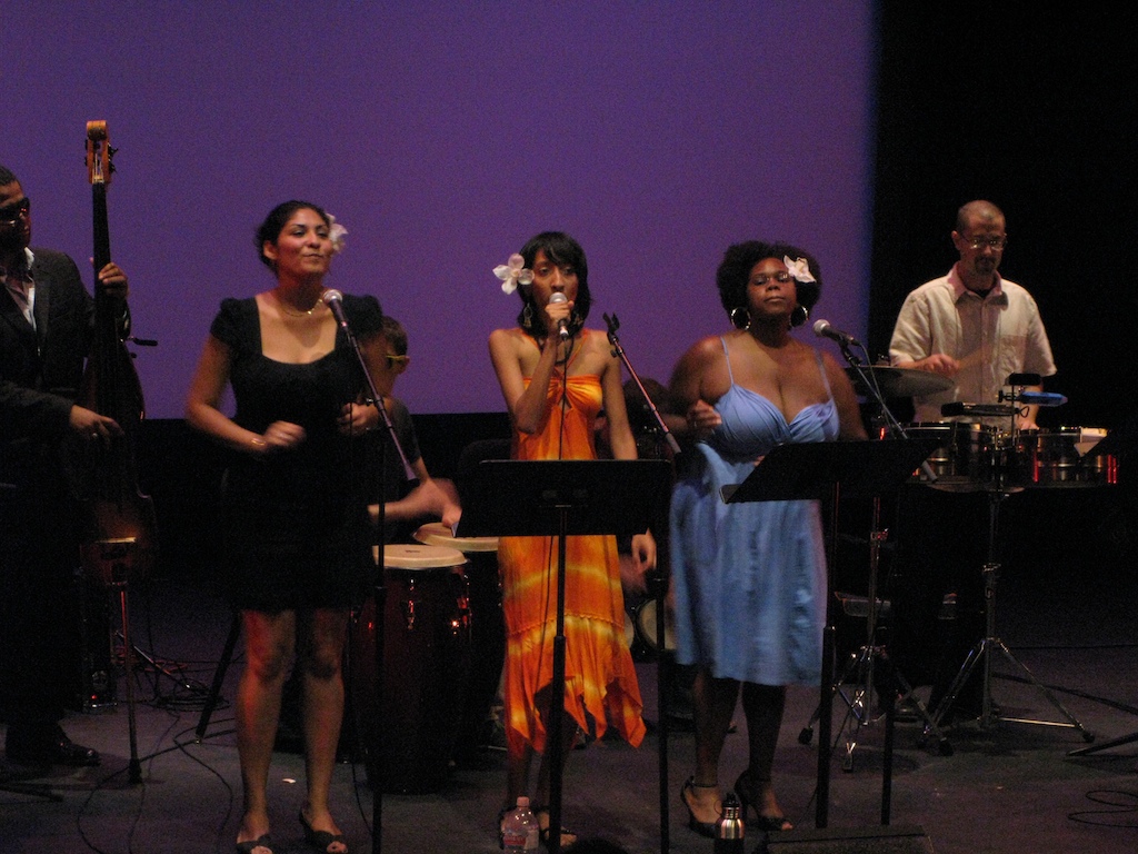 a group of people are standing near some instruments