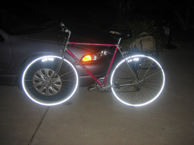 bike wheels are glowing with the lights on