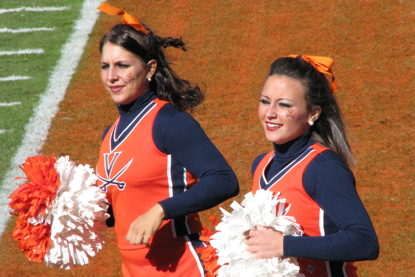 the cheerleaders are all wearing orange and blue