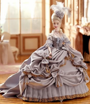 an elegant doll wearing a very large dress