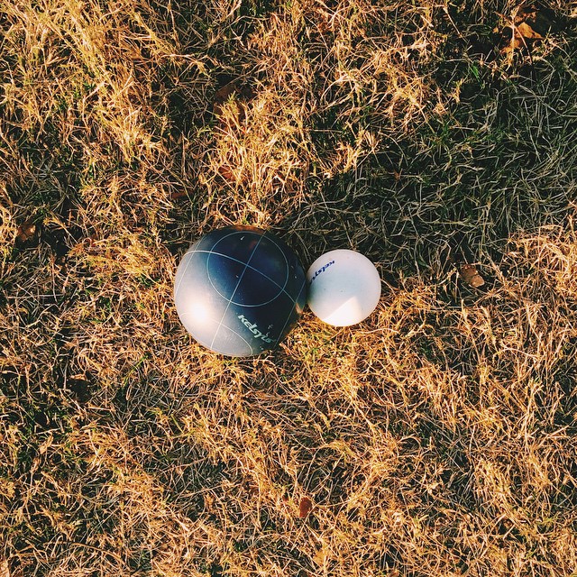 two balls lay on the ground, top down