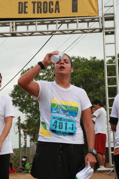 men who are standing under a banner and water