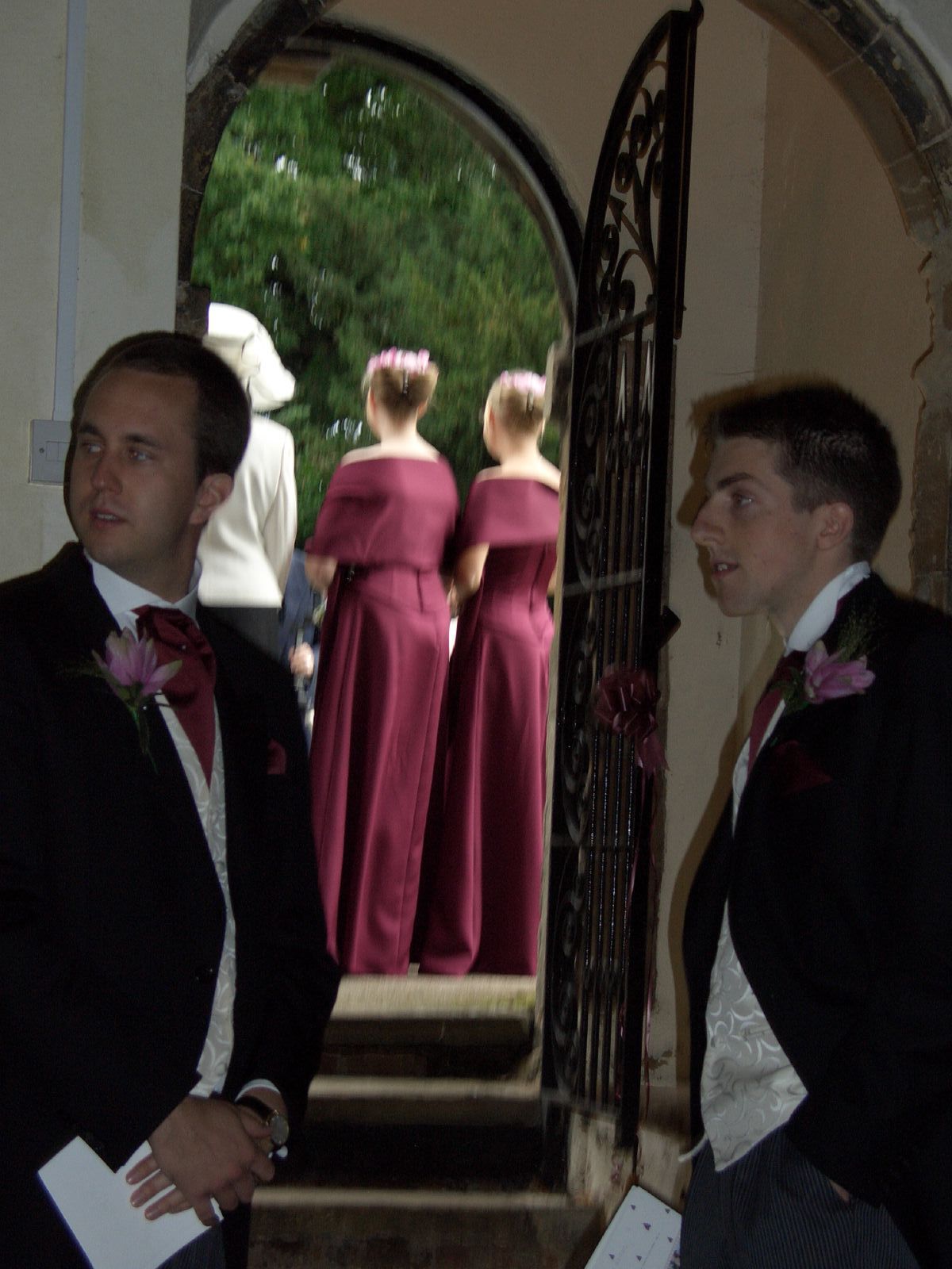 two men looking at each other through a mirror