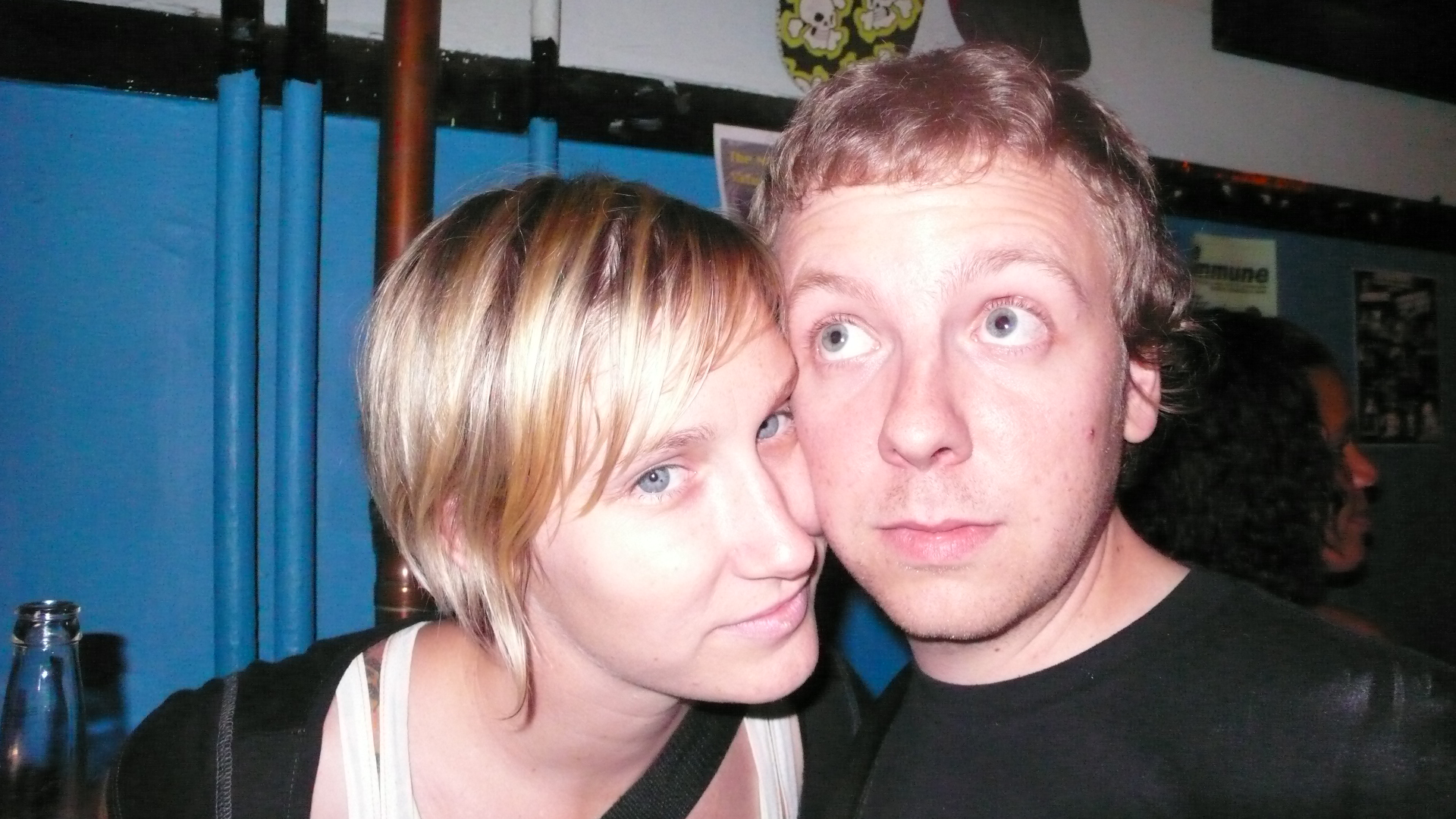 a man and woman looking into the camera with blue eyes