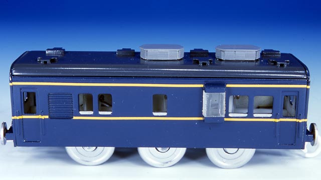 a toy train engine sitting on top of a white surface