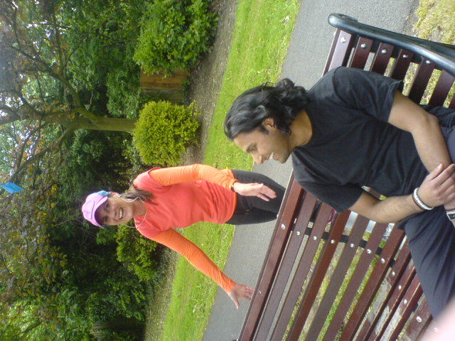a woman showing another person soing on the bench