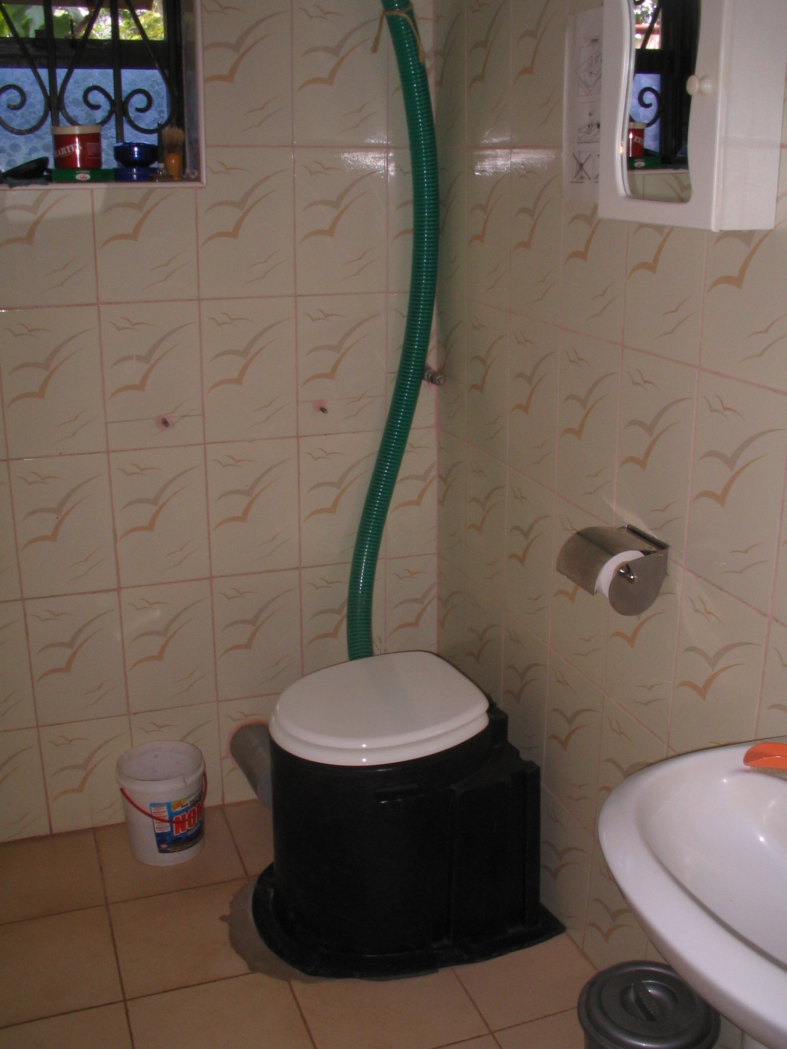 a shower hose is connected to the wall