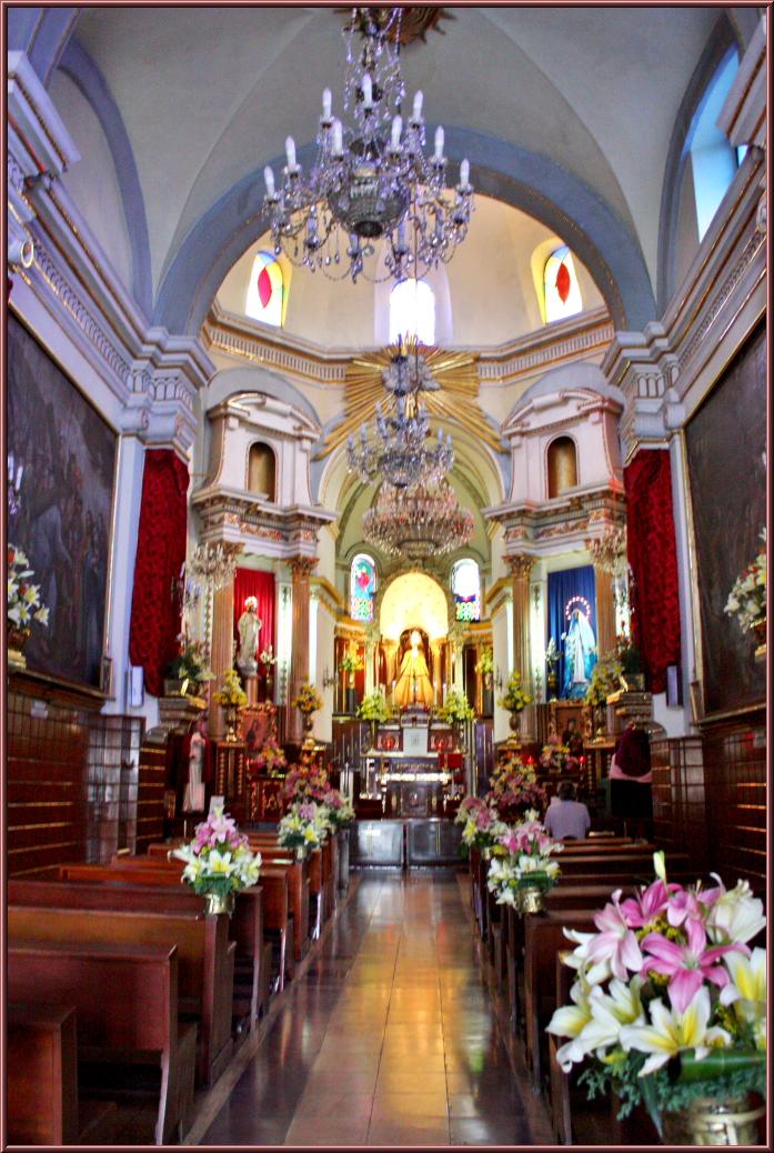 a large church with colorful floral arrangement displayed