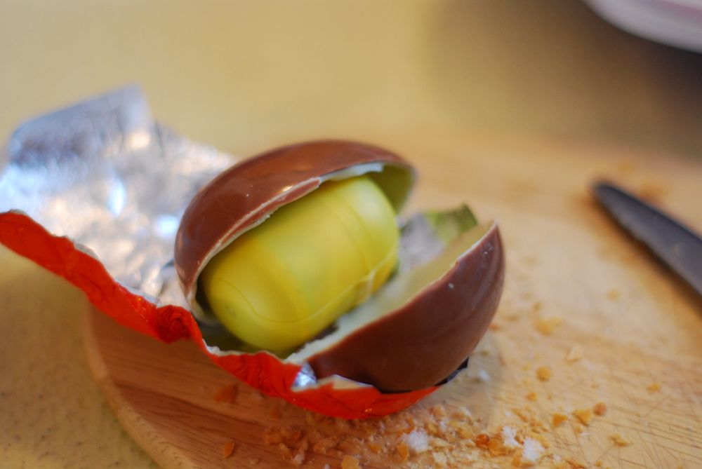 a close up of an avocado inside of an egg shell