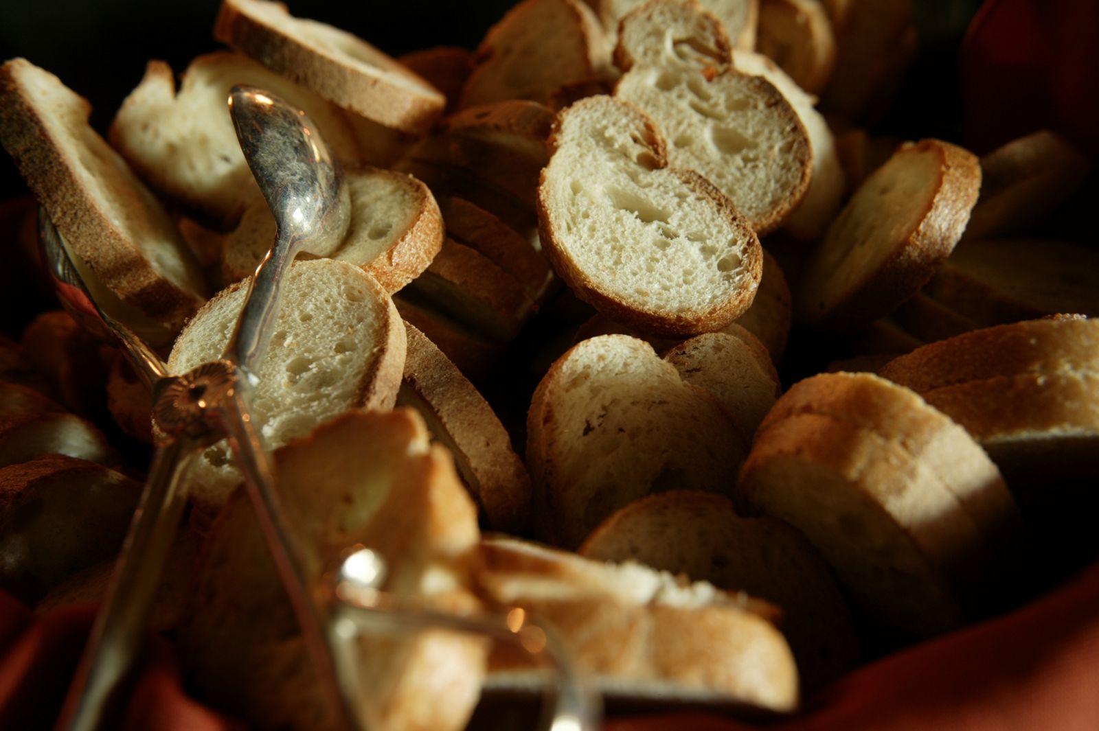 a bowl filled with bread and a spoon