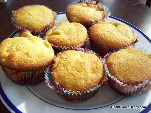 several small muffins sit on a blue and white plate