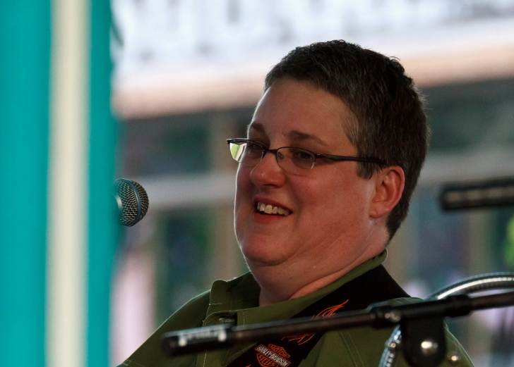 a person in uniform is standing up and smiling