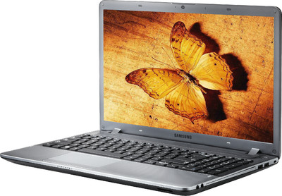 a laptop is shown with three yellow erflies on the screen