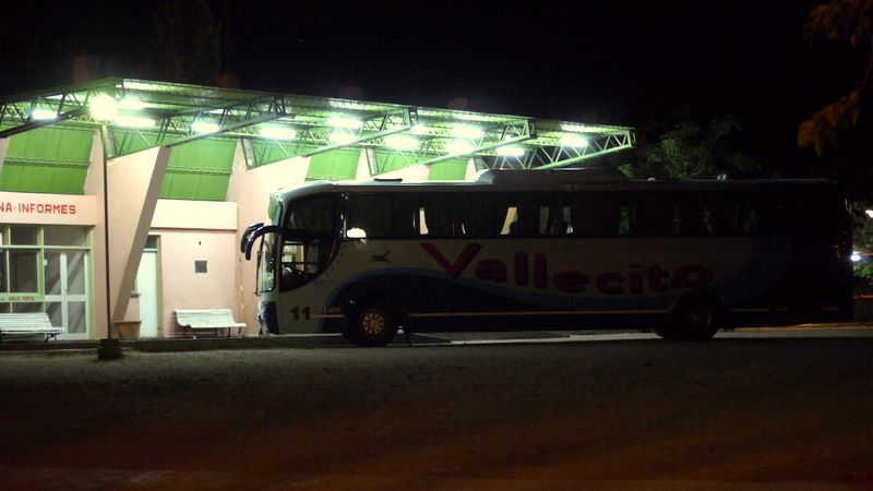a large bus parked in front of a building